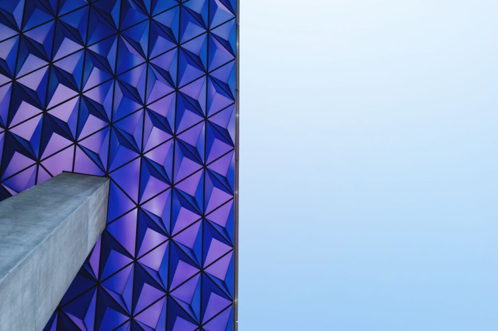Futuristic geometric facade with blue and purple patterns in Toronto.